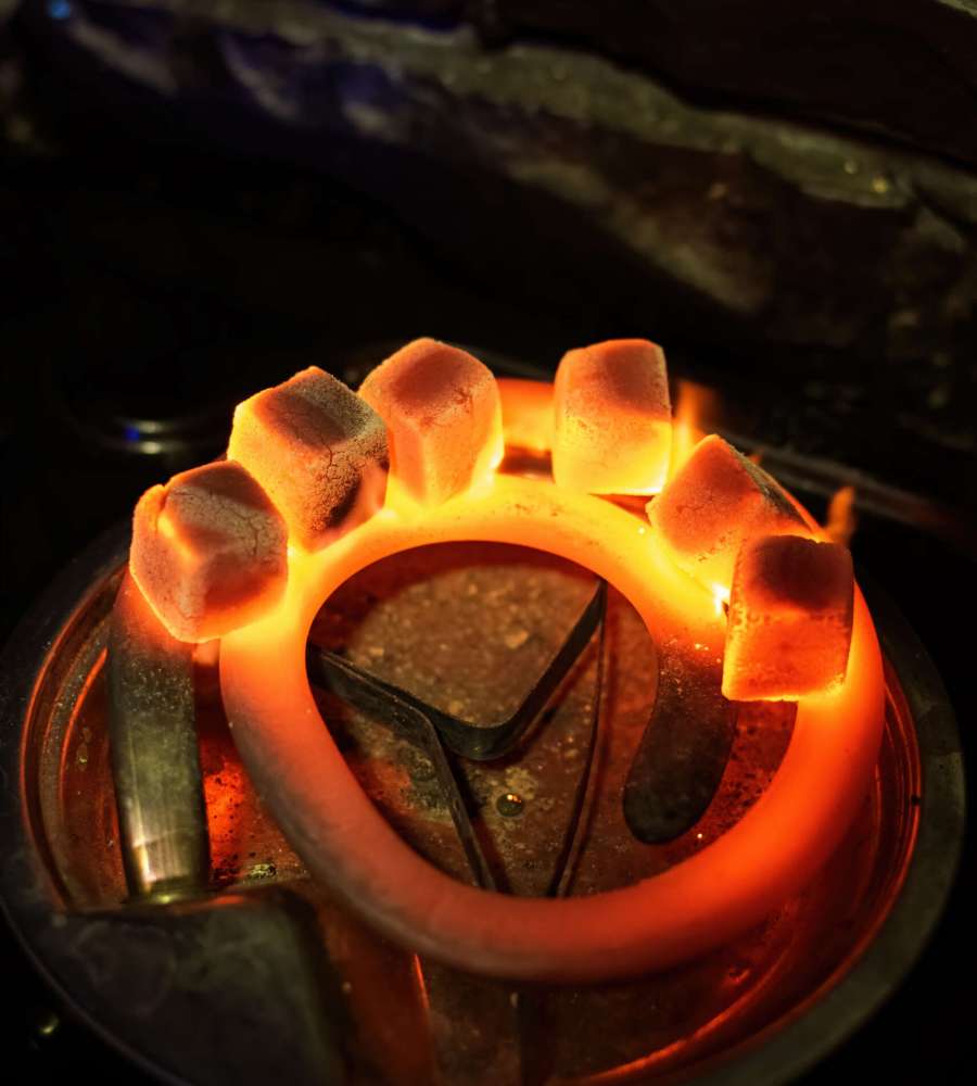 Six coals for hookah heating on the stove